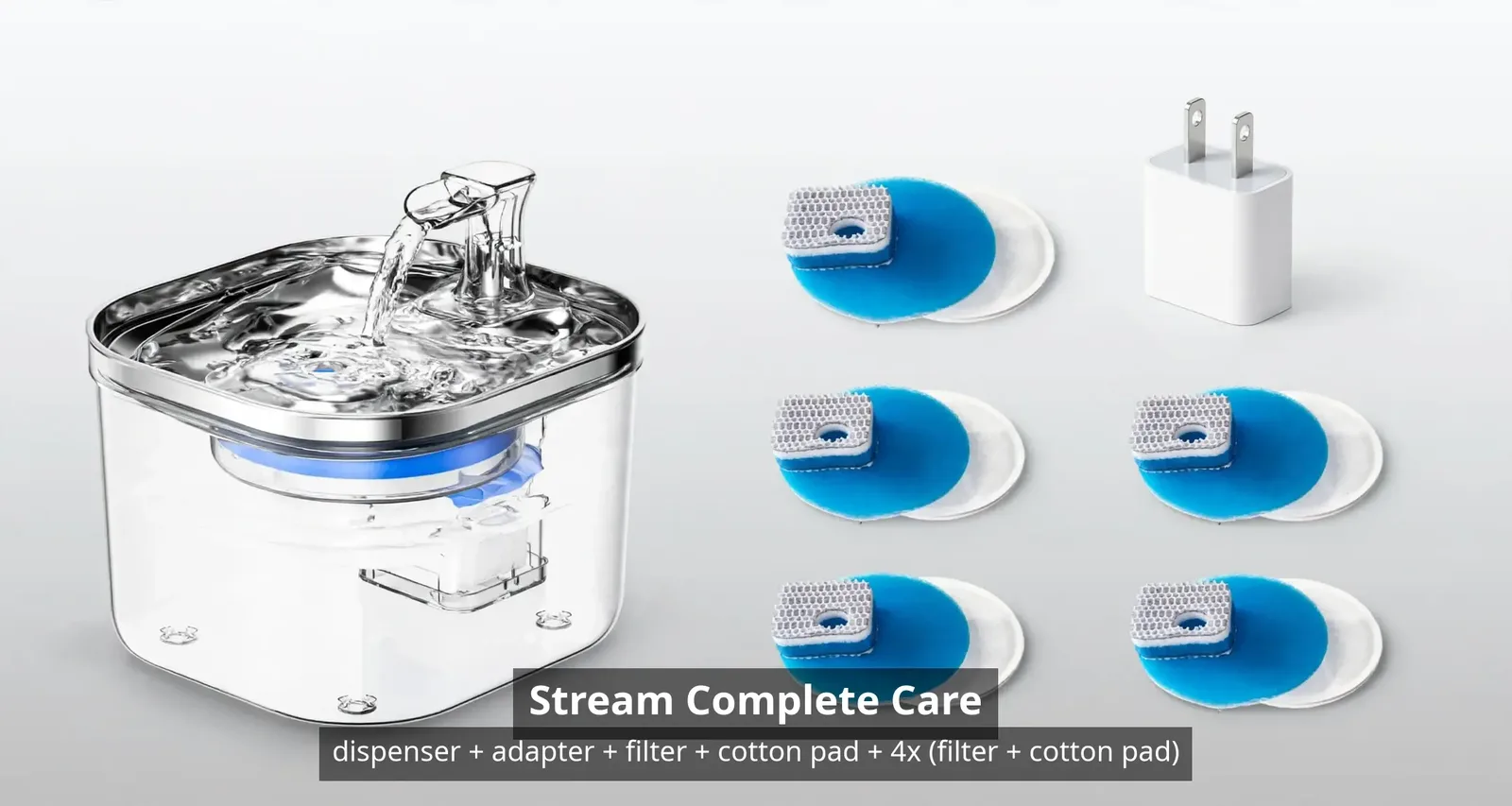 Stream Complete Care bundle contents: the fountain, power adapter, one filter and cotton pad, plus four extra filter-and-cotton-pad sets